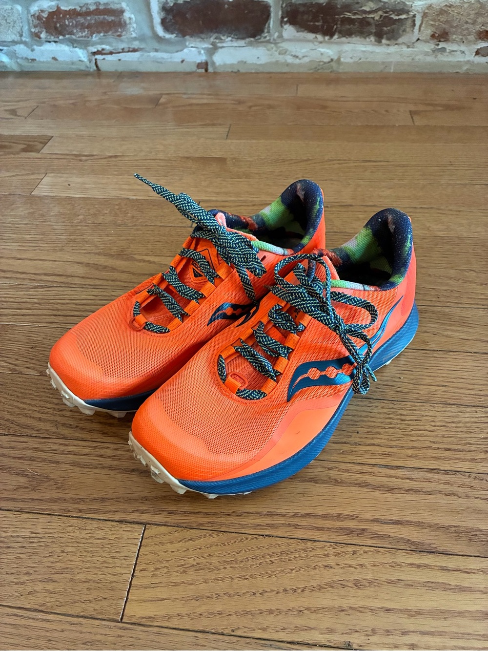 Saucony Bright Orange Women’s Trail Sneakers with Blue Trim